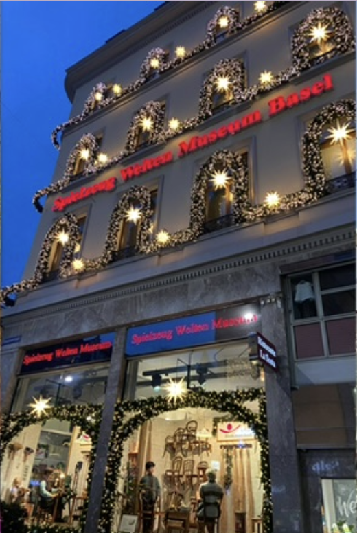 In Switzerland, many buildings are adorned with  decorations such as lights and wreaths.